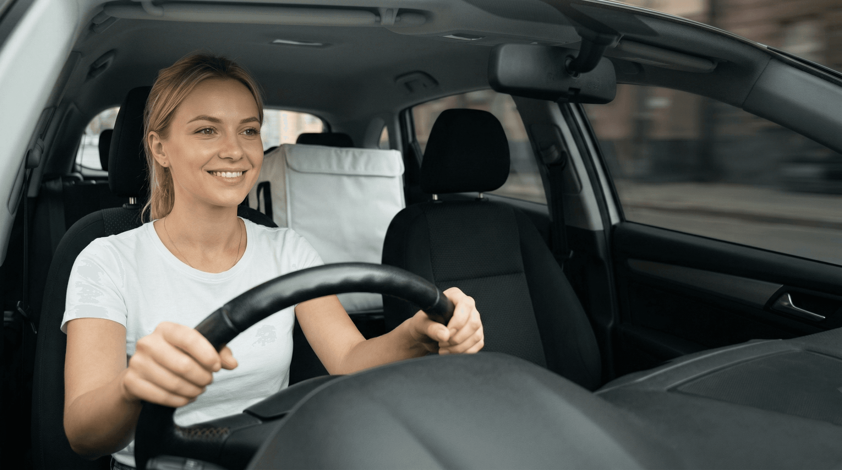 PrimeRide courier behind the wheel